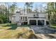 Charming two-story home with a two-car garage, chimney, and inviting front porch at 3485 Sheree Trl, Stone Mountain, GA 30087