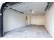 An empty garage with concrete floor and a white door at the back at 3485 Sheree Trl, Stone Mountain, GA 30087
