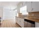 Galley kitchen open to breakfast nook with bright natural light and modern appliances at 3485 Sheree Trl, Stone Mountain, GA 30087