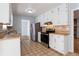 Functional kitchen features stainless steel appliances, ample counter space, and neutral flooring at 3485 Sheree Trl, Stone Mountain, GA 30087