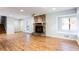 Spacious living room features a stone fireplace, hardwood floors, and a cozy window seat at 3485 Sheree Trl, Stone Mountain, GA 30087