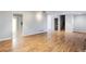 Bright and airy living room featuring hardwood flooring, neutral walls, and an open layout at 3485 Sheree Trl, Stone Mountain, GA 30087