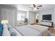 Comfortable main bedroom showcasing ensuite bath, hardwood floors, and ample natural light at 3485 Sheree Trl, Stone Mountain, GA 30087