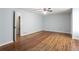 Empty main bedroom with hardwood floors and ensuite bathroom access at 3485 Sheree Trl, Stone Mountain, GA 30087