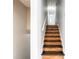 Stairway with wood treads and white risers leading to the upper level at 3485 Sheree Trl, Stone Mountain, GA 30087