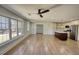 Open-concept living room and kitchen featuring stainless steel appliances and hardwood flooring at 6751 Davidson Ct, Lithonia, GA 30058