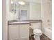 Bathroom featuring a white vanity, a large mirror, and a toilet and tub at 955 Juniper Ne St # 4125, Atlanta, GA 30309