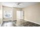 A bright bedroom is shown with tiled floor and a window, and a door to a closet at 955 Juniper Ne St # 4125, Atlanta, GA 30309