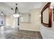 Elegant dining area with stylish chandelier, wainscoting, and views to outdoors at 955 Juniper Ne St # 4125, Atlanta, GA 30309