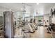 Fitness center with treadmills, weight machines, mirrors, ceiling fans, and weights for residents at 955 Juniper Ne St # 4125, Atlanta, GA 30309