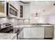 Contemporary kitchen with stainless steel appliances, granite countertops, and tiled backsplash at 955 Juniper Ne St # 4125, Atlanta, GA 30309
