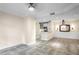 Spacious living room featuring neutral walls, tile flooring, and an adjacent kitchen area with white cabinetry at 955 Juniper Ne St # 4125, Atlanta, GA 30309