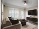 Bright living room with large window, sleek furniture, and neutral color palette at 955 Juniper Ne St # 4125, Atlanta, GA 30309