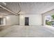 Interior view of a parking garage with concrete floors, painted walls, and marked parking spaces at 955 Juniper Ne St # 4125, Atlanta, GA 30309