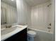 Modern bathroom featuring sleek white subway tile and a combination tub and shower at 254 Lotus Ln, Covington, GA 30016