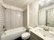 Well-lit bathroom featuring modern fixtures, bright finishes, and a combination tub and shower at 254 Lotus Ln, Covington, GA 30016