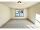 Bright bedroom with neutral carpet and gray trim has ample natural light from the window view at 254 Lotus Ln, Covington, GA 30016