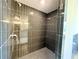 Sleek shower featuring modern fixtures and dark tile, creating a contemporary look at 254 Lotus Ln, Covington, GA 30016