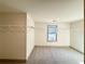 Walk-in closet with ample shelving and neutral carpeting and a window for natural light at 254 Lotus Ln, Covington, GA 30016