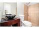 Bathroom featuring a bowl sink and a glass-enclosed shower with tan tiling at 2725 Palmview Sw Ct, Atlanta, GA 30331