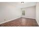 A gray bedroom with tile floors, a window and white trim at 2725 Palmview Sw Ct, Atlanta, GA 30331