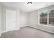 This bedroom has a big window and lots of carpet, for a comfy, and modern look at 2725 Palmview Sw Ct, Atlanta, GA 30331