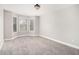 Empty bedroom with neutral walls, carpet, and large windows for natural light at 2725 Palmview Sw Ct, Atlanta, GA 30331