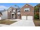 Brick two-story home with a two-car garage, well-kept lawn, and lovely curb appeal at 2725 Palmview Sw Ct, Atlanta, GA 30331