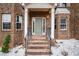 Inviting entryway with brick steps and columns, showcasing the home's architectural details at 2725 Palmview Sw Ct, Atlanta, GA 30331