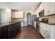 Spacious kitchen featuring stainless steel appliances, granite countertops and wooden cabinets at 2725 Palmview Sw Ct, Atlanta, GA 30331