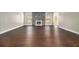 Open living room with hardwood floors, a stone fireplace, and lots of natural light at 2725 Palmview Sw Ct, Atlanta, GA 30331