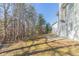 The home's backyard offers a treed perimeter and a small patio area at 3127 Leyland Ct, Decatur, GA 30034