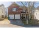 Charming two-story brick home with a two-car garage and well-maintained front yard at 3127 Leyland Ct, Decatur, GA 30034