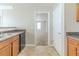 Kitchen area showcasing stainless steel sink, laminate countertops and pass-through to next room at 3127 Leyland Ct, Decatur, GA 30034