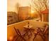 Inviting balcony featuring outdoor seating with a wine bottle, offering a relaxing space with an urban view at 589 Auburn Ne Ave # F, Atlanta, GA 30312