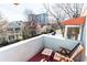 Balcony with outdoor seating, offering city views, surrounded by lush trees and serene neighborhood charm at 589 Auburn Ne Ave # F, Atlanta, GA 30312
