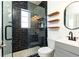 Newly renovated bathroom with a walk-in glass shower, vanity, and herringbone floor at 589 Auburn Ne Ave # F, Atlanta, GA 30312