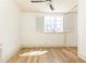 Sunlit bedroom with hardwood floors, large window and modern ceiling fan at 589 Auburn Ne Ave # F, Atlanta, GA 30312