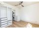 Modern bedroom featuring built-in storage, modern fan, and hardwood floors at 589 Auburn Ne Ave # F, Atlanta, GA 30312