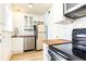 Bright kitchen featuring stainless appliances, butcher block counters, white cabinetry, and subway tile backsplash at 589 Auburn Ne Ave # F, Atlanta, GA 30312