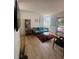 Cozy living room with comfortable seating, open layout, lots of light, modern furniture and wood floors at 589 Auburn Ne Ave # F, Atlanta, GA 30312