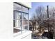Framed view from a window of a tree-lined street and nearby houses under a bright sky at 589 Auburn Ne Ave # F, Atlanta, GA 30312