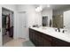 Bathroom with dual sinks, granite countertops, and a walk-in glass shower at 852 Constellation Dr, Decatur, GA 30033