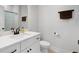 Bright bathroom featuring a white vanity with black hardware and a shower with a patterned curtain at 852 Constellation Dr, Decatur, GA 30033