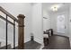 Bright foyer with hardwood floors, staircase, and convenient coat hooks and storage at 852 Constellation Dr, Decatur, GA 30033