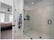 Modern walk-in glass shower with a built-in seat and tiled walls at 852 Constellation Dr, Decatur, GA 30033