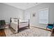 Bright bedroom with a beautiful rug and large windows at 207 Cole Ne St, Marietta, GA 30060