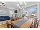 Inviting dining area with natural light, chandelier, and a seamless flow to the living room at 207 Cole Ne St, Marietta, GA 30060