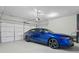 A blue car in a garage with a white door at 207 Cole Ne St, Marietta, GA 30060