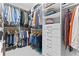 Organized walk-in closet with custom shelving, drawers, and ample storage space at 207 Cole Ne St, Marietta, GA 30060